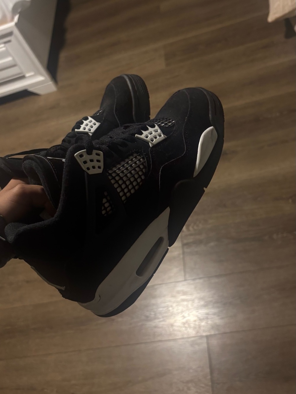 Air Jordan 4 Retro “White Thunder” sneakers.